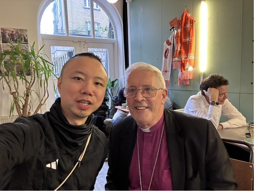 Dr Michael Tang with Bishop Christopher Chessun of Southwark in a café