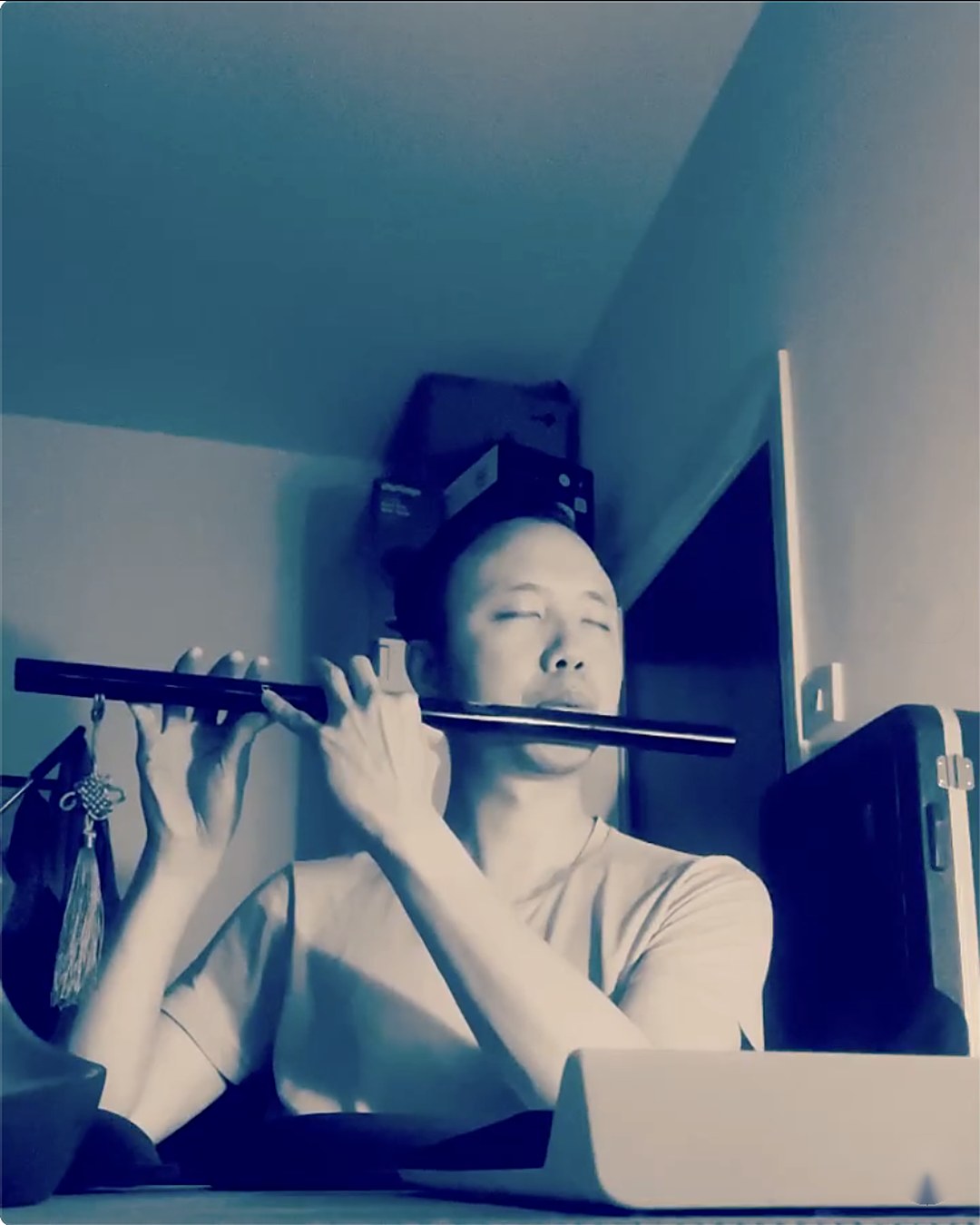 Michael Tang playing the flute